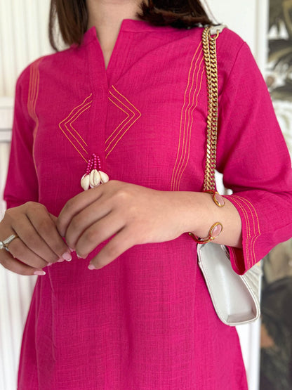 Pure cotton, clean lines, and just the right pop of pink Cord Set