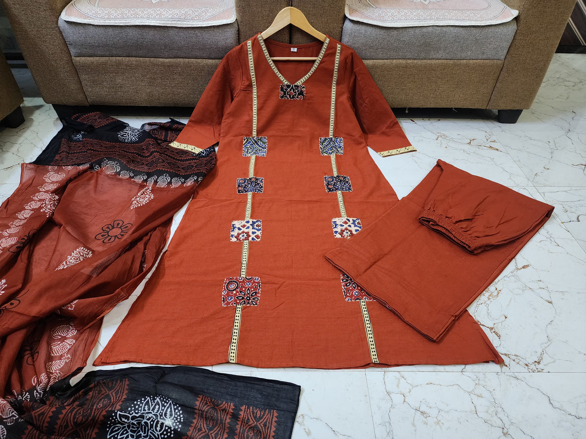 Classic Orange Kurta Set with Artistic Patch Detailing & Dupatta